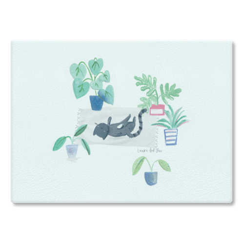 black cat lying on grey scandi rug - glass chopping board by lauradidthis