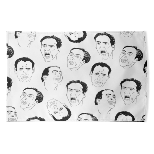 Cage gives good face - funny tea towel by kirstin stride