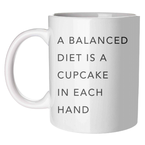 A Balanced Diet Is A Cupcake In Each Hand - unique mug by Toni Scott