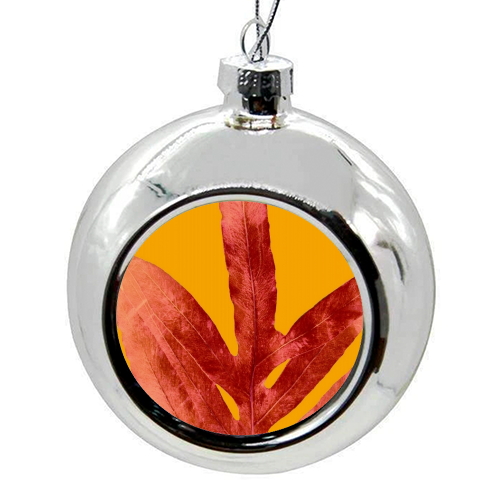 Green Fern on Red On Fire - colourful christmas bauble by Alicia Noelle Jones