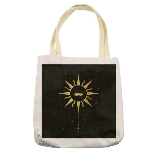 evil eye golden sun - printed tote bag by Anastasios Konstantinidis