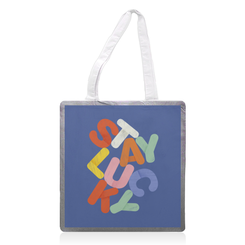 Stay Lucky: A Colorful Reminder of Positivity - printed canvas tote bag by Ania Wieclaw
