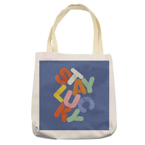 Stay Lucky: A Colorful Reminder of Positivity - printed canvas tote bag by Ania Wieclaw