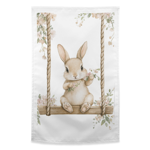 Bunny in a wooden swing - funny tea towel by haris kavalla
