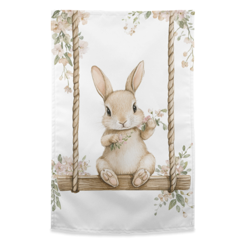Bunny in a wooden swing - funny tea towel by haris kavalla