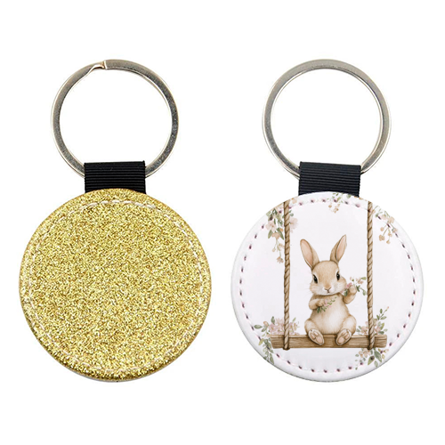 Bunny in a wooden swing - keyring by haris kavalla