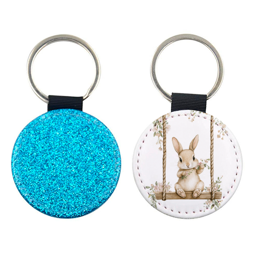 Bunny in a wooden swing - keyring by haris kavalla