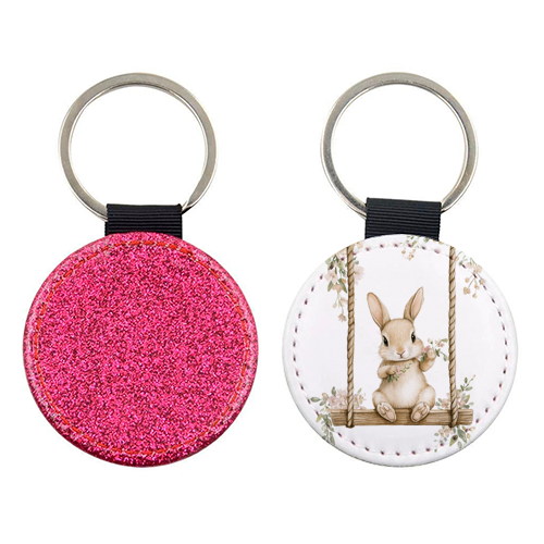 Bunny in a wooden swing - keyring by haris kavalla