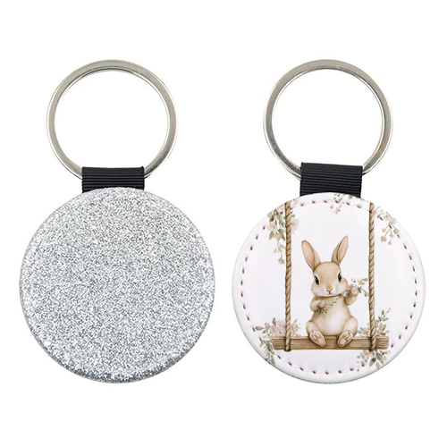 Bunny in a wooden swing - keyring by haris kavalla