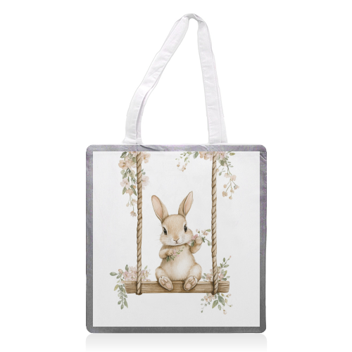 Bunny in a wooden swing - printed canvas tote bag by haris kavalla