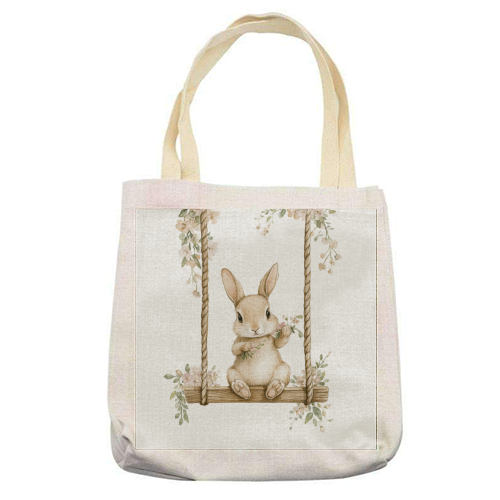 Bunny in a wooden swing - printed canvas tote bag by haris kavalla