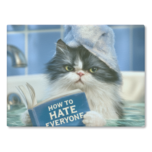 A cat in bathtube reading book "How to hate everyone" - glass chopping board by DejaReve
