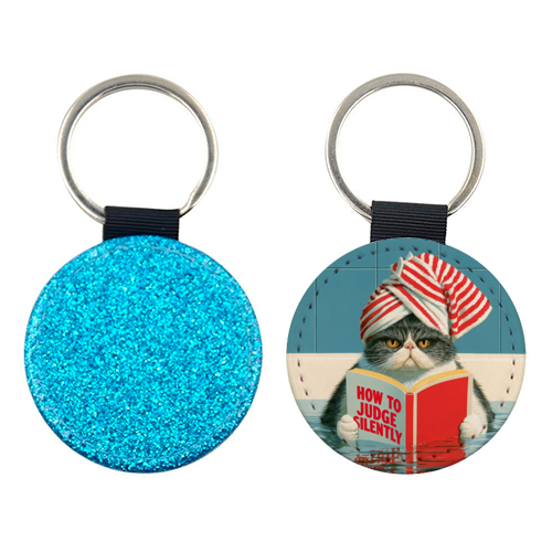 A cat reading book about Judging - keyring by DejaReve