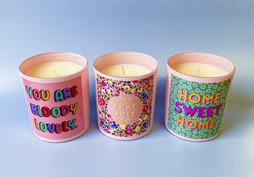 Personalised scented candles from a natural wax: French Vanilla, Rose & Peony and Lime, Basil & Mandarin and Wild Fig & Patchouli, each with corresponding artwork.